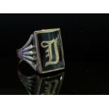 A 9ct gold signet ring, black enamelled front with "D" monogram, size Z,