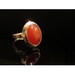 A gold Cornelian oval ring stamped 14K, size M, 6.