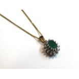 A 9ct gold diamond and emerald pendant hung on chain, 46cm long chain, 2.