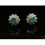 A pair of diamond and emerald daisy earrings, 1.