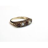 A 9ct gold garnet and pearl five stone ring, size N, 2.