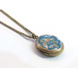 A Victorian gold engraved double locket with blue enamel oval front with bird and branch design,