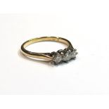 A gold three stone diamond ring, size P/Q, 2.