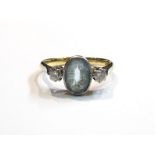 An 18ct gold aquamarine and diamond ring, size L,