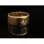 An 18ct gold band set with single diamond in star setting, size S, 8.