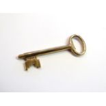 A 9ct gold key with spring mechanism, 9.