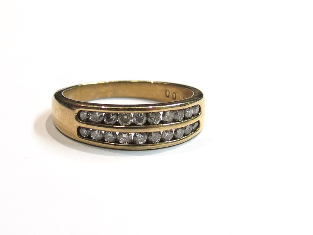 A 9ct gold double row diamond half hoop ring, size Q, 3.