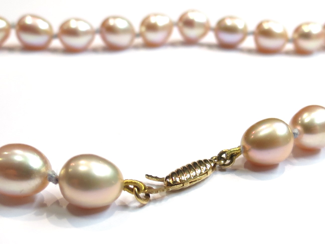 A strand of pear shaped cultured pearls, pink tone, 14ct gold clasp, 46cm length, 29.