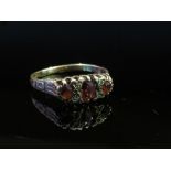 A 9ct gold ruby and diamond ring with engraved shoulders, size O, 1.