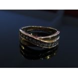 WITHDRAWN - A 9ct gold band set with a row of brilliant cut diamonds, size Q, 3.