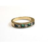 A gold emerald and diamond half hoop ring, un-marked, size N, 3.