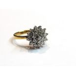 An 18ct gold diamond cluster ring, size M, 4.