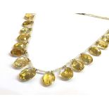 A seed pearl neck chain hung with seventeen graduated oval citrines with gold clasp,