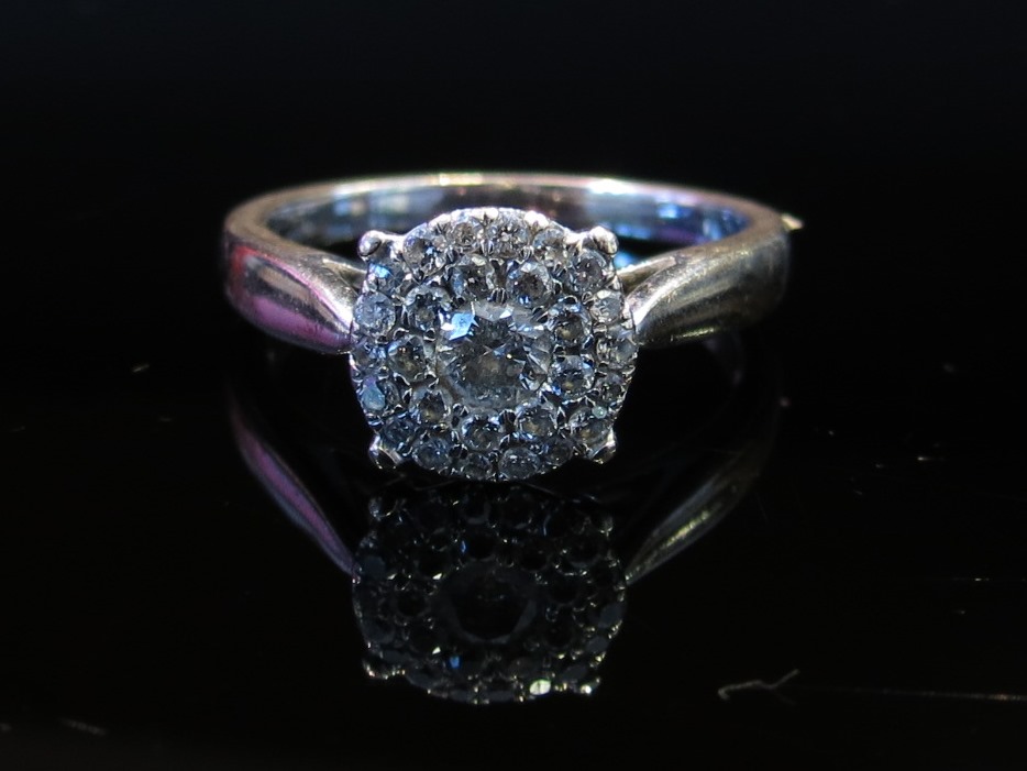 A white gold diamond cluster ring stamped 750, size Q, - Image 2 of 2