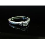 A white gold diamond ring stamped 9K, size N, 1.