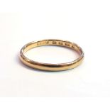 A 22ct gold wedding band, size P, 2.