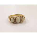 An 18ct gold three stone opal and diamond ring, size N, 4.