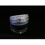 A white gold multi row diamond set ring stamped 18kt 1.