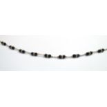 A 9ct gold chain and French jet bead necklace, 43cm long, 6.