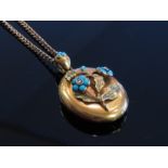 A 9ct gold neck chain hung with a Victorian glass panel back locket,