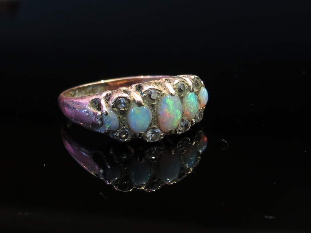 A 9ct gold diamond and opal ring, size J, 2.