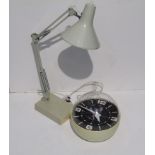 A Newgate "bubble" clock together with an anglepoise lamp