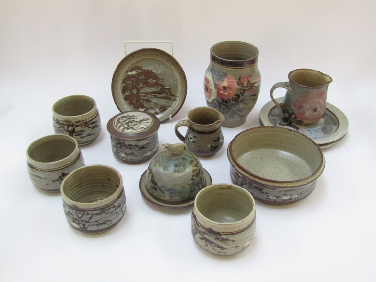 KATHLEEN ELLEN MARIGOLD AUSTIN (1929-2018): A collection of calendula pottery teawares,