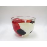 A Svaja Art glass bowl clear with encased forms in white, black and red.