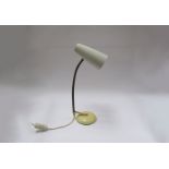 A circa 1950's desk lamp with adjustable arm,