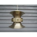 A Danish pale brassed ceiling light of diablo form with central collar with plastic mouldings