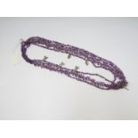 Seven row natural amethyst bead festish style necklace of different shapes hunt with silver