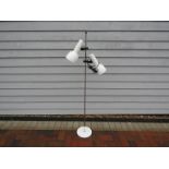 A white and chrome finish standard lamp with twin adjustable spots