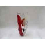 A Svaja Art glass tall vase in clear with encased forms in white, black and red.