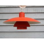 A Louis Poulsen three tiered Danish ceiling light in orange and white