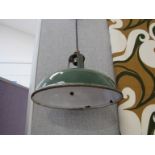 Two green enamel pendant lights, 27.5cm and 23.