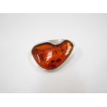 Silver modernist 20th Century brooch (silver mark to pin) set with large cognac amber stone