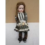 An Armand Marseille bisque headed and composition body girl doll,