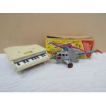 A boxed Tudor Rose Inter City Helicopter Service plastic friction toy and a toy piano