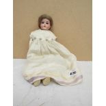 An Armand Marseille bisque headed and kid body girl doll,