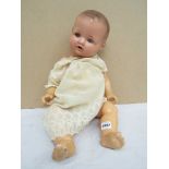 An Armand Marseille composition doll marked A M Germany 520/ 6K