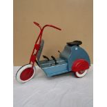 A child's 1960's pedal tricycle, repainted,
