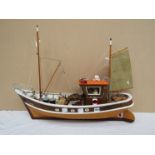 A remote controlled fishing boat, 'Miss Nellie' with figures on board,