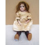 An Armand Marseille bisque headed and kid body doll head stamped 370 AM.2/OX.