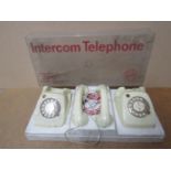 A child's vintage intercom telephone set