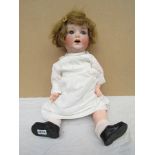 An Armand Marseille bisque headed and composition body doll,