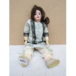 A bisque headed and composition body girl doll, head stamped Germany R9/0Q,