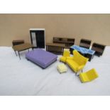 A collection of vintage Triang hard plastic dolls house furniture