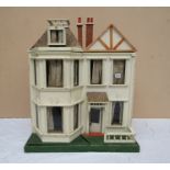 A 1920's dolls house and assorted contents