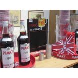 Three 1Ltr bottles of Pimms and a quantity of Pimms advertising items including Ice bucket,