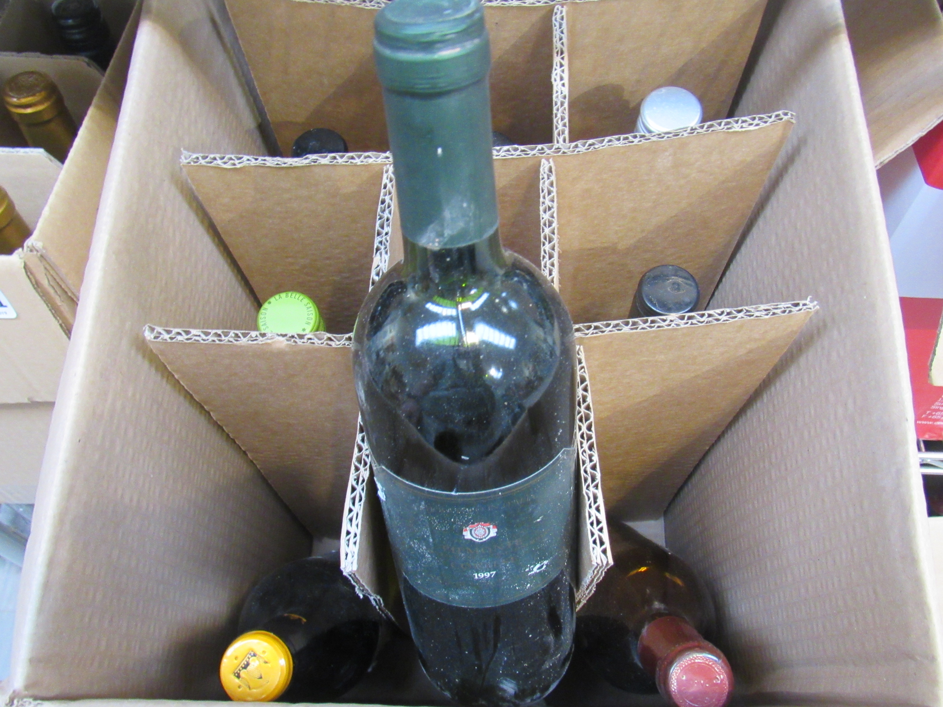 Eleven various bottles of red and white wine and two half bottles including Sauvignon Blanc and